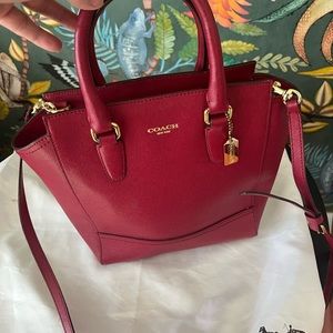 Coach leather bag in port color. Hardly used, perfect condition